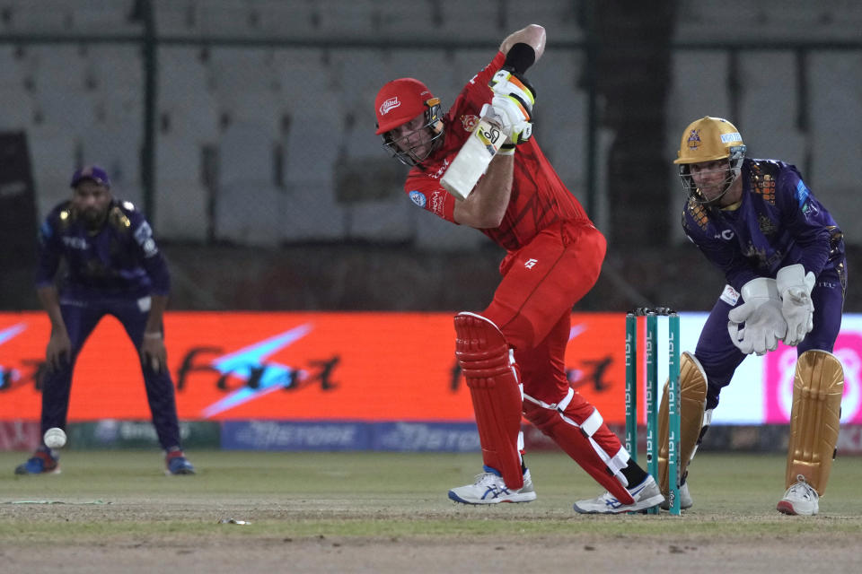 Islamabad United' Martin Guptill, center, plays a shot during the Pakistan Super League T20 cricket eliminator match between Islamabad United and Quetta Gladiators, in Karachi, Pakistan, Friday, March 15, 2024. (AP Photo/Fareed Khan)