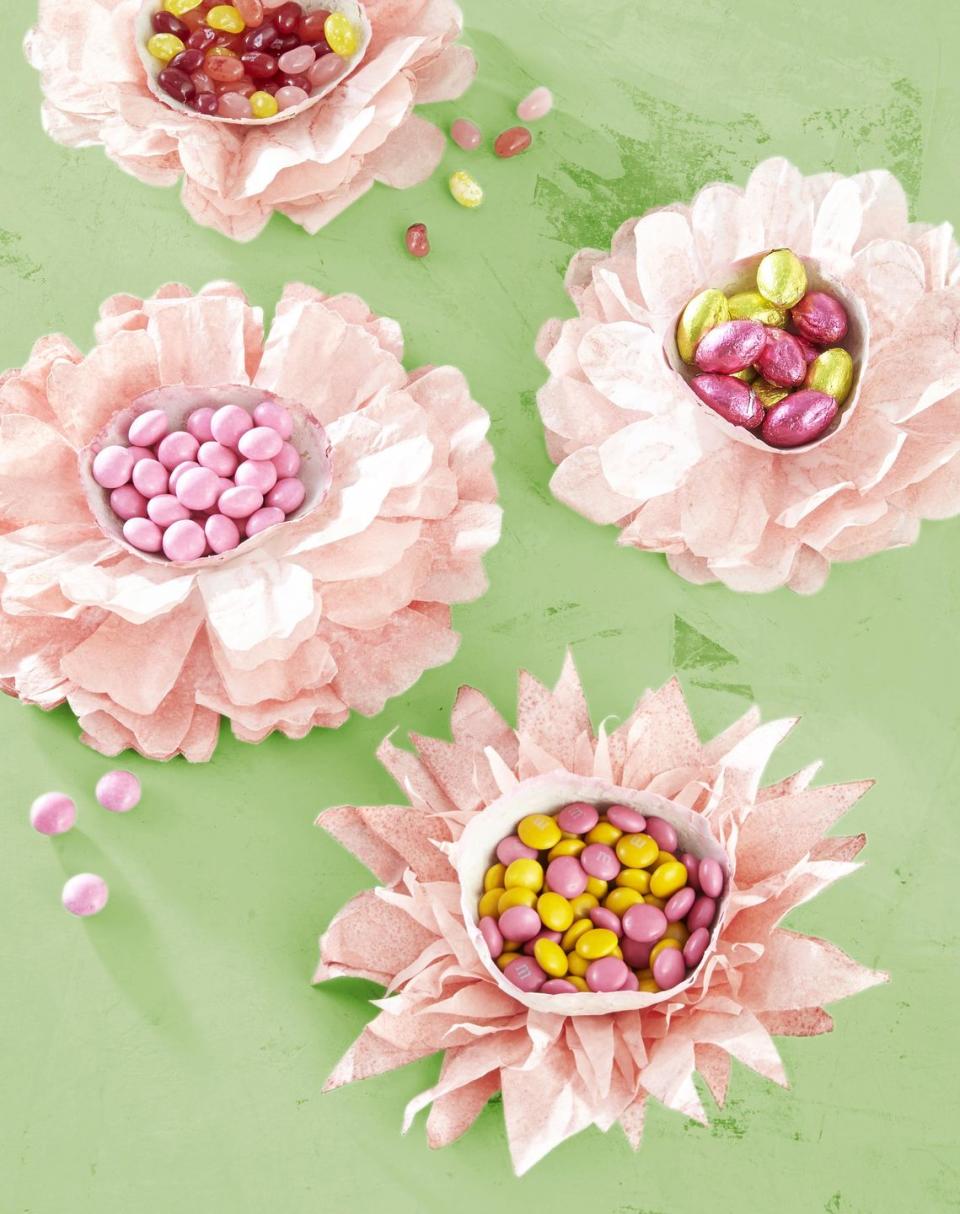 <p>Make these flowering candy dishes with an item you probably already have in your house: coffee filters.</p><p><strong>To make:</strong> Submerge regular-size white coffee filters (you’ll need four to six for each flower) in a watered-down Rit Dye solution (here, Petal Pink); dry completely. Cut into flower shapes of various sizes, and stack largest to smallest. Attach at centers with craft glue. Glue a papier-mâché or store-bought candy cup to center of each. Fill with candy.</p><p><a class="link " href="https://www.amazon.com/Rit-Dye-Liquid-Fabric-8-Ounce/dp/B0011455FY/ref=sr_1_2?tag=syn-yahoo-20&ascsubtag=%5Bartid%7C10050.g.1111%5Bsrc%7Cyahoo-us" rel="nofollow noopener" target="_blank" data-ylk="slk:SHOP RIT DYE;elm:context_link;itc:0;sec:content-canvas">SHOP RIT DYE</a></p>