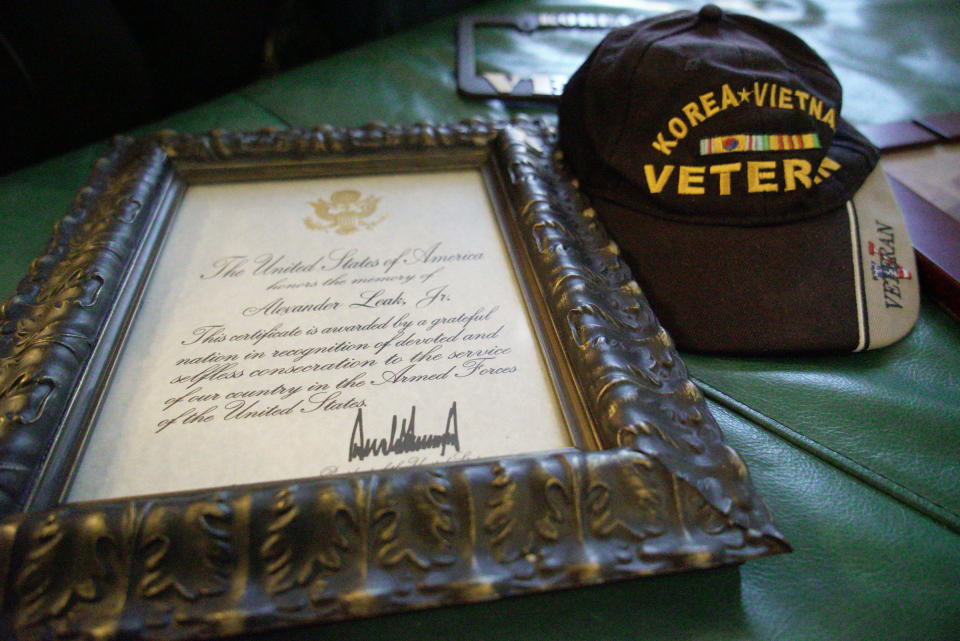 A veteran's condolence letter signed by President Donald Trump sits beside Alex Leak Jr.'s favorite cap at his daughter's home in Greensboro, N.C., on Wednesday, Nov. 4, 2020. The Army veteran died in July after collapsing from dehydration at his assisted-living facility, and the family believes pandemic-related neglect is to blame. (AP Photo/Allen G. Breed)