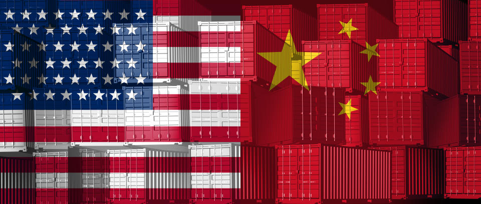 China US trade business concept as a Chinese USA tariff war and American tariffs as two opposing groups of cargo freight containers as an economic dispute or relationship over import and exports as a 3D illustration.