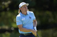 Cameron Smith, of Australia, watches his shot off the sixth tee during the third round of the St. Jude Championship golf tournament, Saturday, Aug. 13, 2022, in Memphis, Tenn. (AP Photo/Mark Humphrey