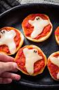 <p>These pizza bites could either be dinner for the kids or appetizers for the adults.</p><p><em><strong>Get the recipe at <a href="https://www.delish.com/holiday-recipes/halloween/recipes/a49353/ghost-pizza-bagels-recipe/" rel="nofollow noopener" target="_blank" data-ylk="slk:Delish;elm:context_link;itc:0;sec:content-canvas" class="link ">Delish</a>.</strong></em></p>