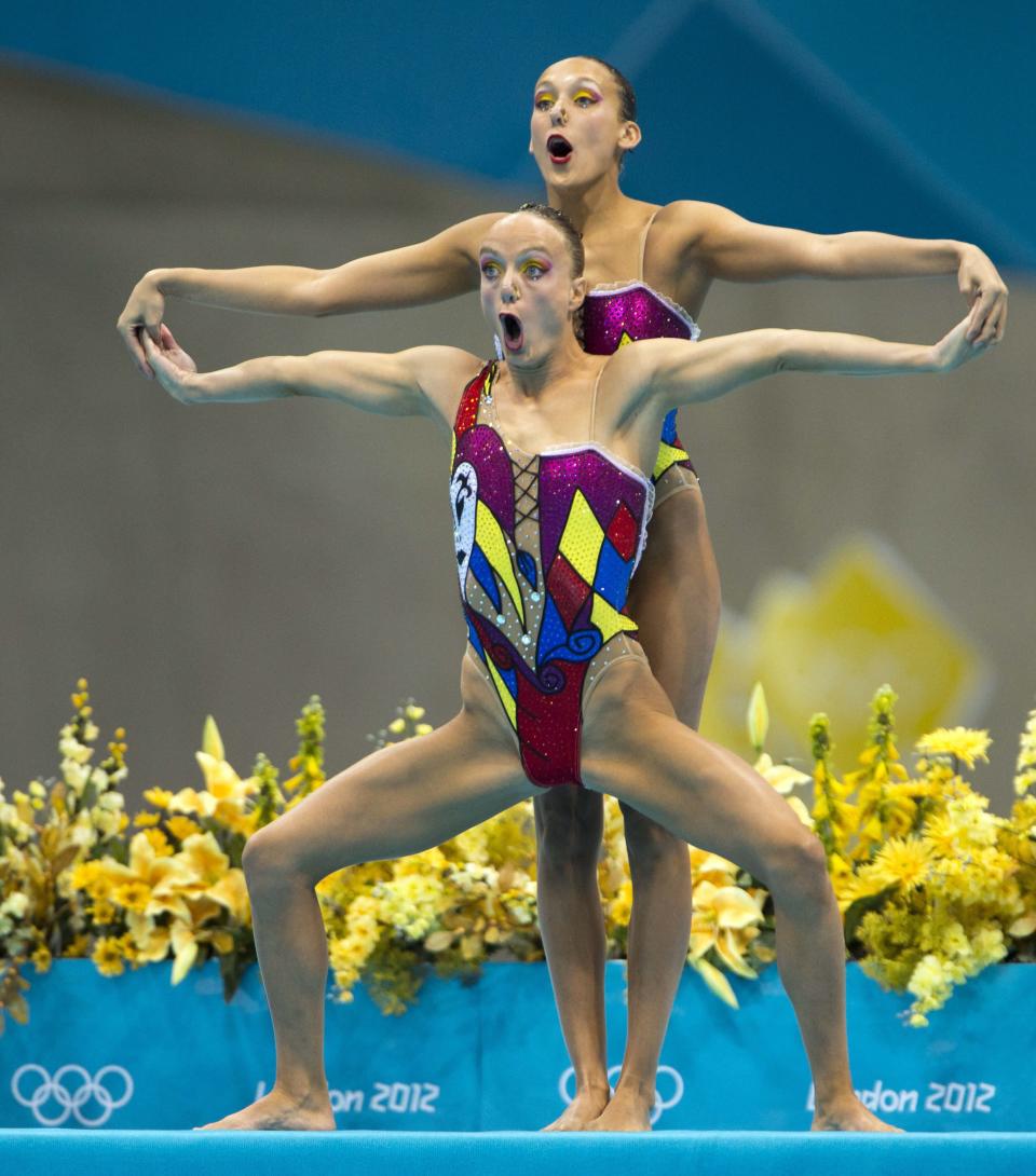 Canada's Marie-Pier Boudrreau Gagnon, front, and Elise Marcotte start their routine during the women's duet synchronized swimming free routine at the Aquatics Centre in the Olympic Park during the 2012 Summer Olympics in London, Monday, Aug. 6, 2012. The pair finished in fourth place. (AP) Photo/The Canadian Press, Ryan Remiorz)