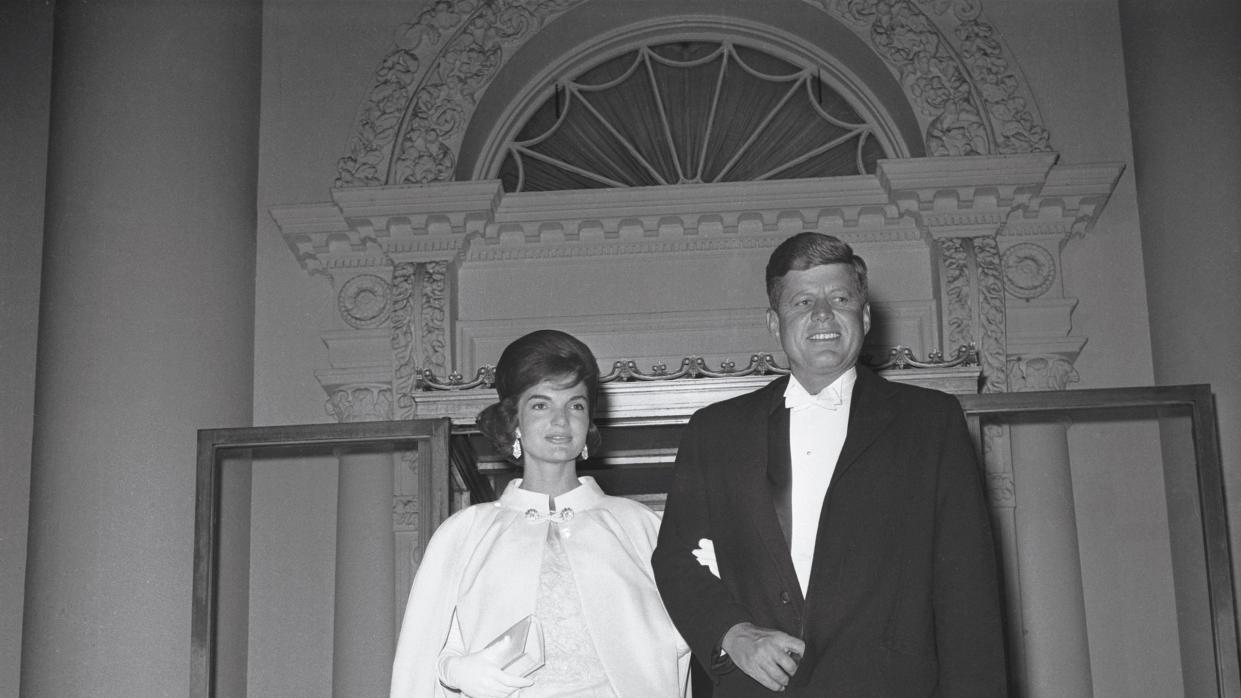 original caption january 20, 1961 washington, dc full length shot of president and mrs john f kennedy as they left the white house to attend a series of inaugural balls five locations were booked to hold the tremendous crowd that wanted to attend the first ladys dress was designed by oleg cassini