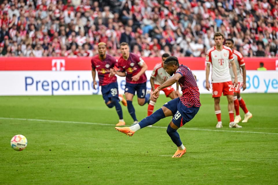 MUNICH, GERMANY - MAY 20: Christopher Nkunku of RB Leipzig scores his team's second goal during the Bundesliga match between FC Bayern München and RB Leipzig at Allianz Arena on May 20, 2023 in Munich, Germany. (Photo by Harry Langer/DeFodi Images via Getty Images)