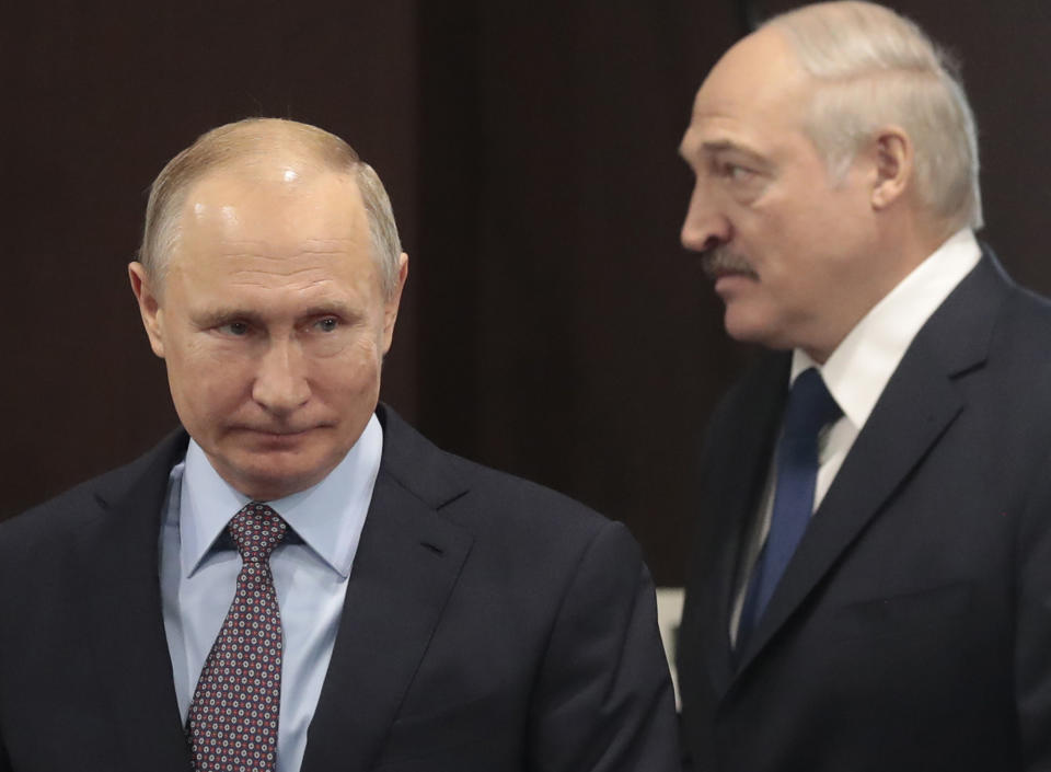 FILE- In this file photo taken on Friday, Feb. 15, 2019, Russian President Vladimir Putin, left, and Belarusian President Alexander Lukashenko meet in the Black sea resort of Sochi, Russia. Alexander Lukashenko's talks with Russian President Vladimir Putin on Monday Sept. 14, 2020, in the Black Sea resort of Sochi come a day after an estimated 150,000 people flooded the streets of the Belarusian capital, demanding Lukashenko's resignation. (Sergei Chirikov/Pool Photo via AP, File)