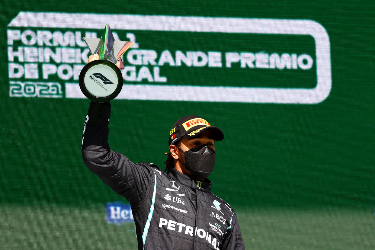 PORTIMAO, PORTUGAL - MAY 02: Race winner Lewis Hamilton of Great Britain and Mercedes GP celebrates on the podium after the F1 Grand Prix of Portugal at Autodromo Internacional Do Algarve on May 02, 2021 in Portimao, Portugal. (Photo by Bryn Lennon/Getty Images)