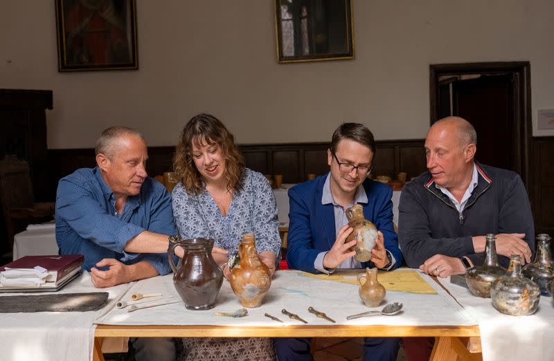 Brothers Julian Barnwell and Lincoln Barnwell along with Professor Claire Jowitt and Dr Ben Redding of University of East Anglia (UEA) look at artefacts recovered from the shipwreck of The Gloucester discovered off the coast of Norfolk