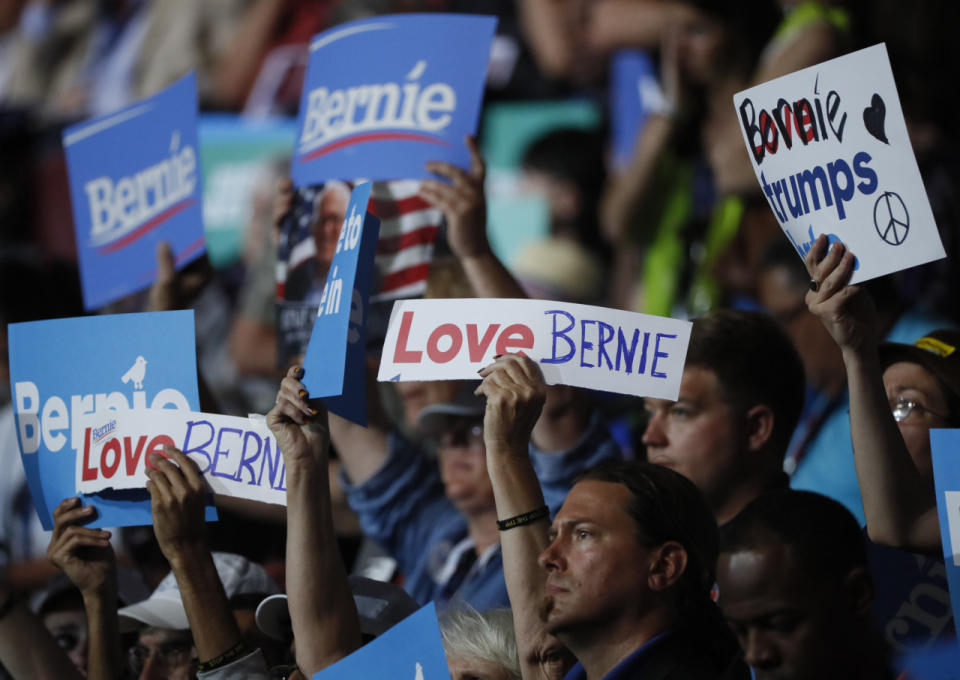 <p>Supporters of former Democratic U.S. presidential candidate Bernie Sanders wave signs during his speech at the Democratic National Convention in Philadelphia, Pennsylvania, July 25, 2016. (REUTERS/Mike Segar)</p>