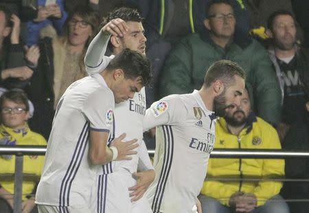 Football Soccer - Villarreal v Real Madrid - Spanish La Liga Santander - Ceramica Stadium, Villarreal, Spain, 26/02/17 Real Madrid's Alvaro Morata (C) celebrates with team mates Pepe and Dani Carvajal after scoring the winning goal. REUTERS/Heino Kalis