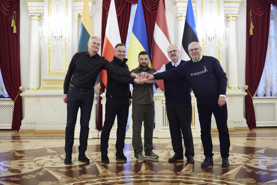 In this image provided by the Ukrainian Presidential Press Office, from left: Lithuania's President Gitanas Nauseda, Polish President Andrzej Duda, Ukrainian President Volodymyr Zelenskyy, Latvian President Egils Levits and Estonia's President Alar Karis pose for a picture during their meeting in Kyiv, Ukraine, Wednesday, April 13, 2022. (Ukrainian Presidential Press Office via AP)