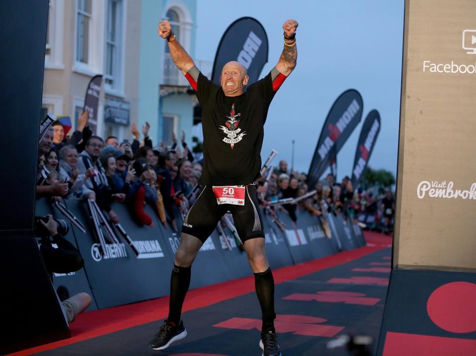 Former Welsh rugby International captain Gareth Thomas reacts after finishing Ironman Wales on September 15 (Getty Images for IRONMAN)