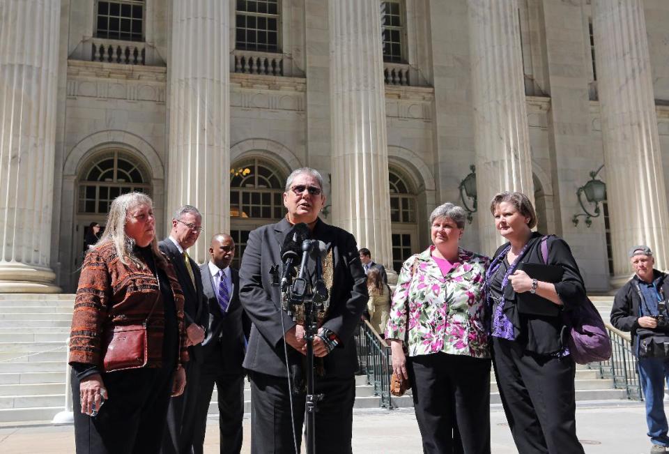 Plaintiffs challenging Oklahoma's gay marriage ban Dr. Gay Phillips, her partner Sue Barton, Sharon Baldwin and her partner Mary Bishop speak with members of the media after leaving court following a hearing at the 10th U.S. Circuit Court of Appeals in Denver, Thursday, April 17, 2014. The appeal of a lower court's January ruling that struck down Oklahoma's gay marriage ban is the second time the issue has reached appellate courts since the U.S. Supreme Court shook up the legal landscape last year by finding the federal Defense of Marriage Act was unconstitutional. (AP Photo/Brennan Linsley)