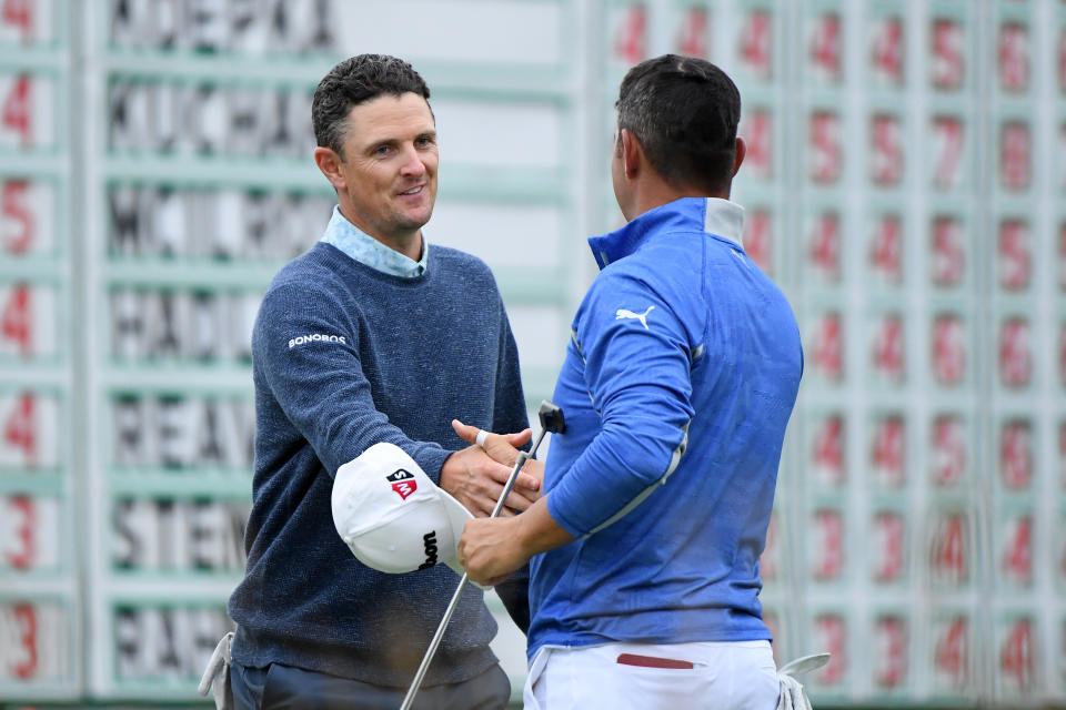 PEBBLE BEACH, CALIFORNIA - JUNE 15: Justin Rose of England (L) and Gary Woodland of the United States shake hands on the 18th green during the third round of the 2019 U.S. Open at Pebble Beach Golf Links on June 15, 2019 in Pebble Beach, California. (Photo by Harry How/Getty Images)