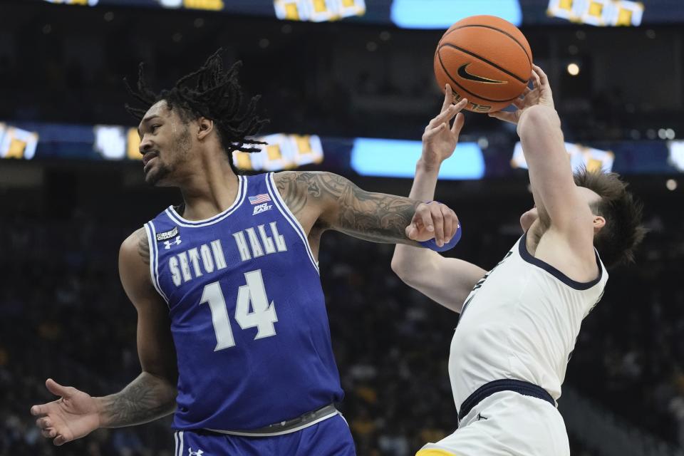 Seton Hall's Dre Davis fouls Marquette's Tyler Kolek during the first half of an NCAA college basketball game Saturday, Jan. 27, 2024, in Milwaukee. (AP Photo/Morry Gash)