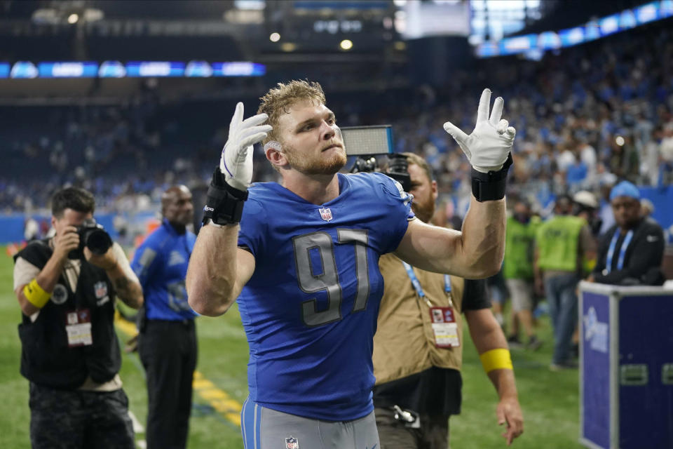 Detroit Lions defensive end Aidan Hutchinson (97) celebrates after an NFL football game against the Washington Commanders Sunday, Sept. 18, 2022, in Detroit. The Lions won 36-27. (AP Photo/Paul Sancya)