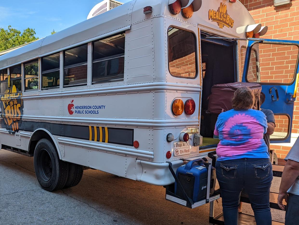 One of the two "Meals On the Bus" buses is loaded with meals at Hendersonville Middle School on July 28, 2022.