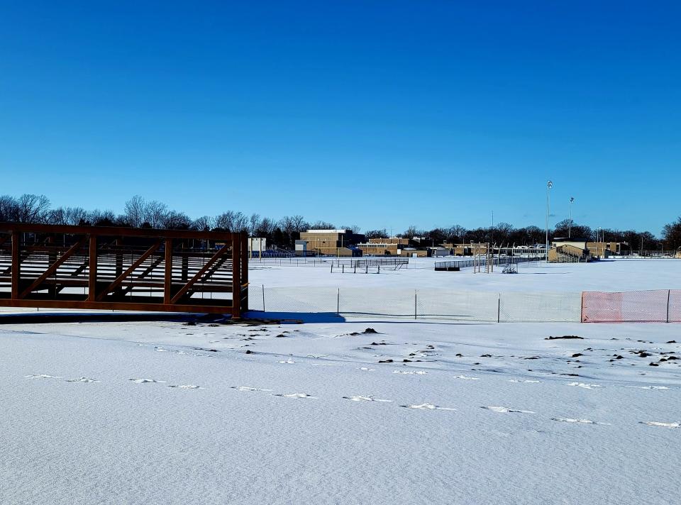The bridge for a $1.4 million, 10-foot pathway over the Black River Canal awaits on Tuesday, Feb. 28, 2023, in view of the athletics fields at Port Huron Northern High School. A joint project, the bridge will connect campuses between the high school and Holland Woods Middle School to the south in addition to accommodating users of the Bridge-to-Bay trail.