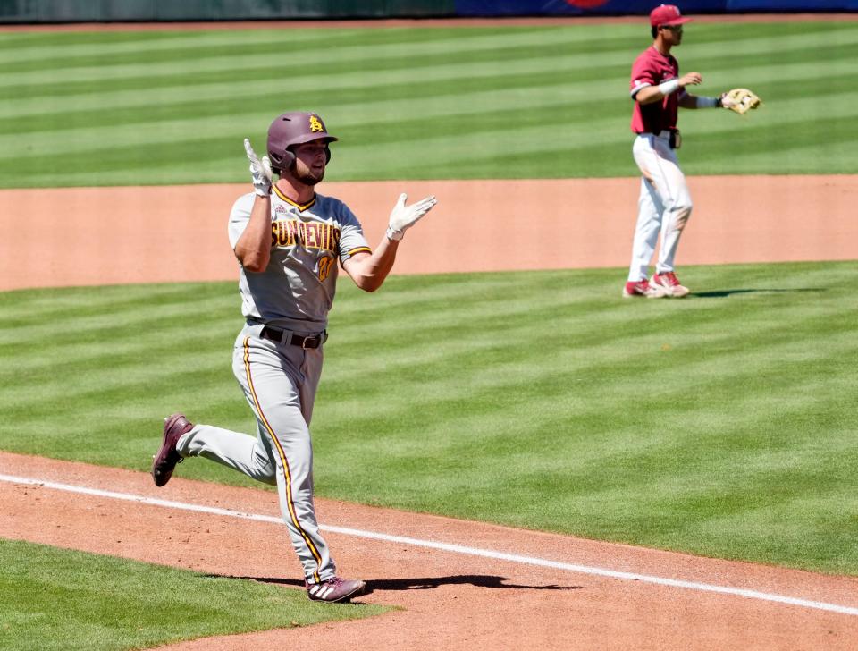 May 25, 2022; Scottsdale, Arizona, USA; Arizona State Will Rogers (21) reacts as he scores on an error by Stanford in the fifth inning during the Pac-12 Baseball Tournament at Scottsdale Stadium.