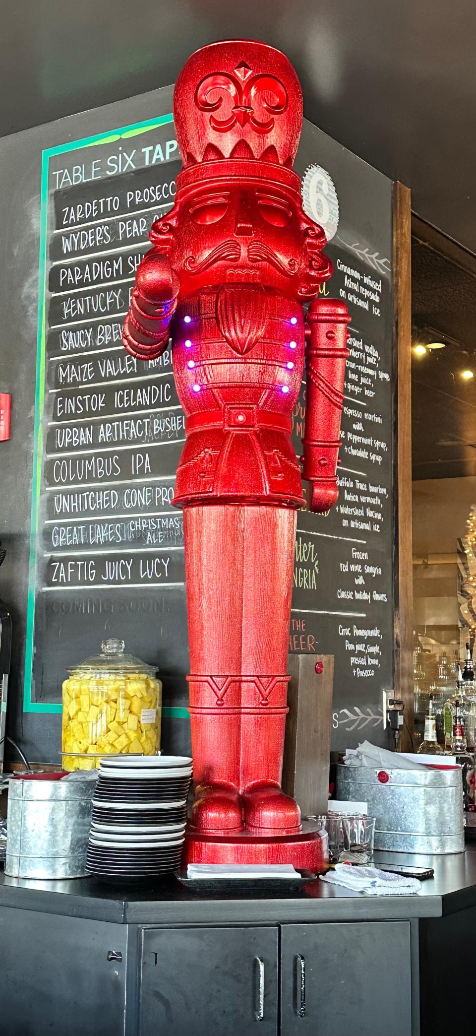 The bar area at Table Six in Jackson Township is decorated for the Christmas season, a perfect complement to its holiday-themed beverages.