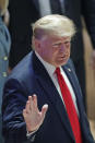 U.S. President Donald Trump waves as he arrives at the World Economic Forum in Davos, Switzerland, Wednesday, Jan. 22, 2020. The 50th annual meeting of the forum is taking place in Davos from Jan. 21 until Jan. 24, 2020. (AP Photo/Michael Probst)