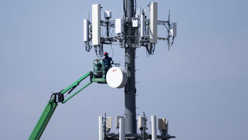 A crew works on a cell tower in Lake Havasu City, Ariz., on Tuesday, August 24, 2021. - Bill Clark/CQ-Roll Call, Inc/Getty Images