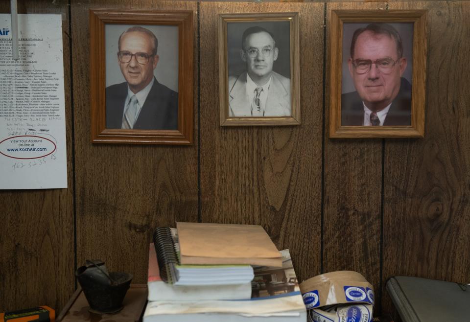 Pictures of Lappe Heating & Air Founder Edward Lappe, center, and his sons Dan Lappe, left, and Dave Lappe hang on the office wall at Lappe Heating & Air in Evansville, Ind., Thursday morning, Dec. 15, 2022. The company is currently in its fourth generation and celebrating its 100th anniversary. 