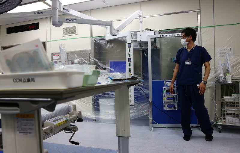 Doctor Shoji Yokobori stands in the ICU which is covered with plastics to prevent the spread of the coronavirus disease (COVID-19) at the hospital in Tokyo
