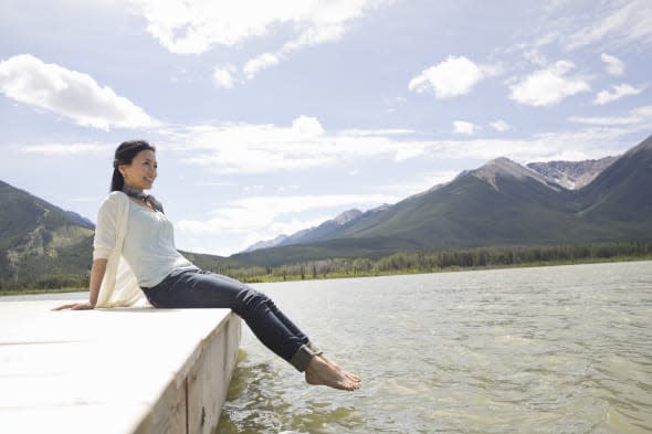 Mature woman enjoying the view from dock