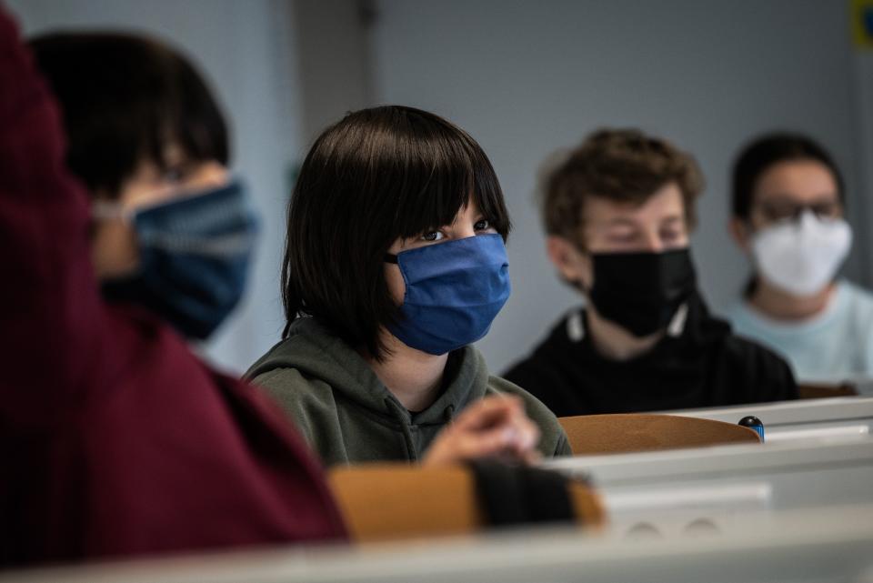 Schoolchildren attend a course in a middle school classroom, on May 18, 2020 in Lyon, central eastern France, after France eased lockdown measures to curb the spread of the COVID-19 pandemic, caused by the novel coronavirus. (Photo by JEFF PACHOUD / AFP) (Photo by JEFF PACHOUD/AFP via Getty Images)