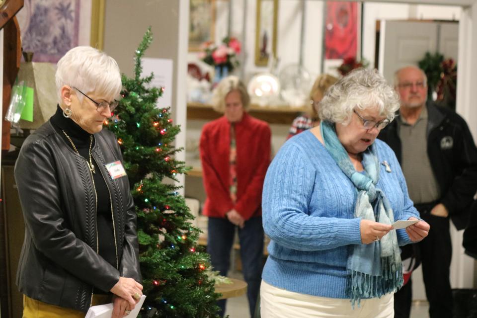 Karen Graham, pastor of Lakeside United Methodist Church, opened the Portage Resale Center's annual grant check presentation with a prayer on 'Giving Tuesday.'