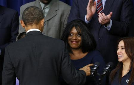 U.S. President Barack Obama greets guests after speaking about the Affordable Care Act at the White House in Washington December 3, 2013. REUTERS/Kevin Lamarque