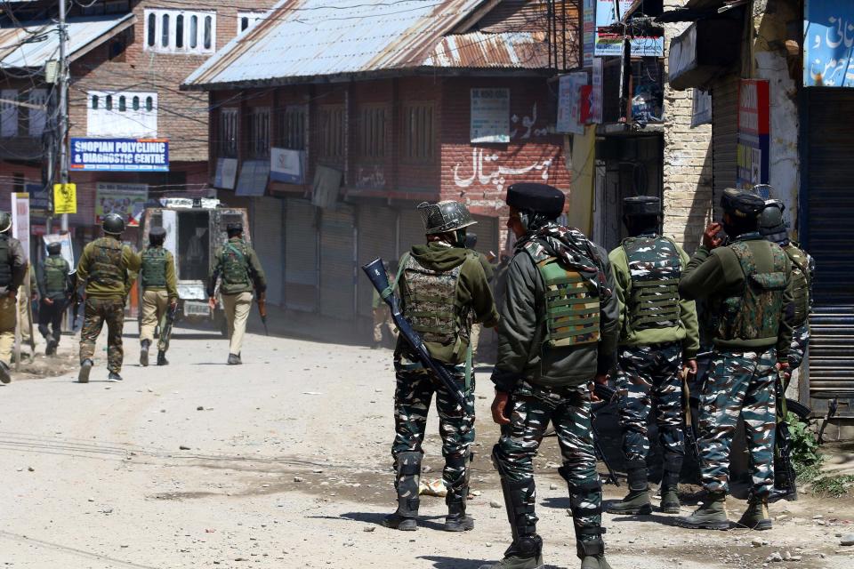 Security forces chases stone pelters during gunfight at Shopian