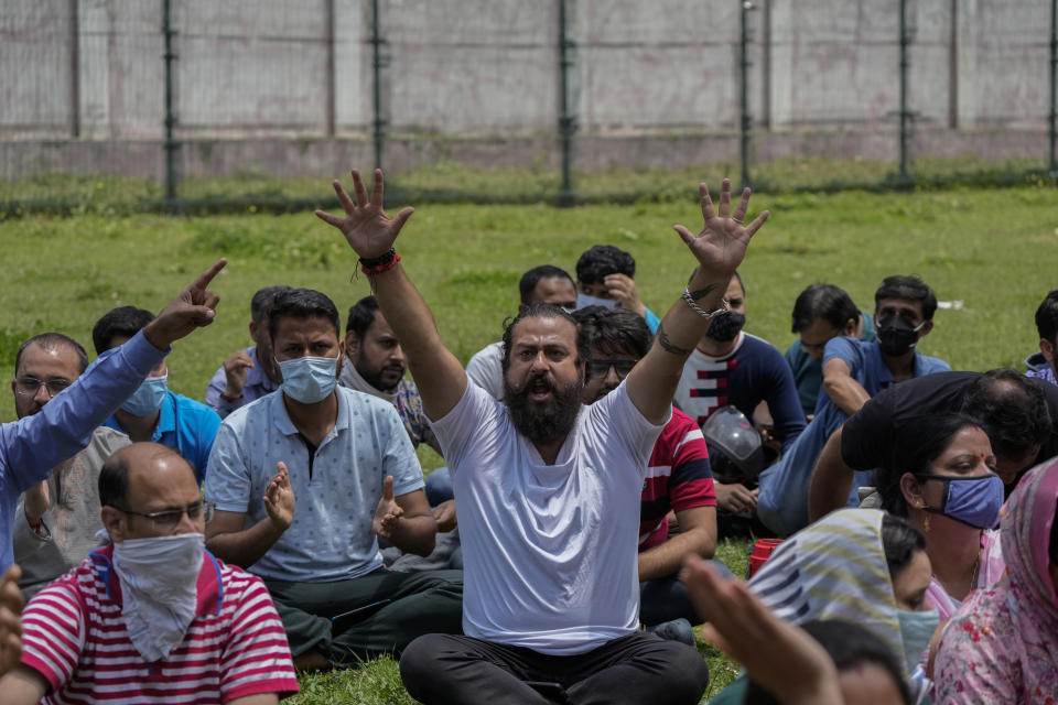 FILE- Kashmiri Hindus protest against the killing of a Hindu female teacher by suspected rebels in Srinagar, Indian controlled Kashmir, Tuesday, May 31, 2022. Assailants fatally shot another Kashmiri Hindu, who are locally known as Pandits, in Indian-controlled Kashmir on Thursday, June 2, said police, who blamed militants fighting against Indian rule for the attack. The Muslim-majority region has witnessed a spate of targeted killings in recent months. (AP Photo/Mukhtar Khan, File)