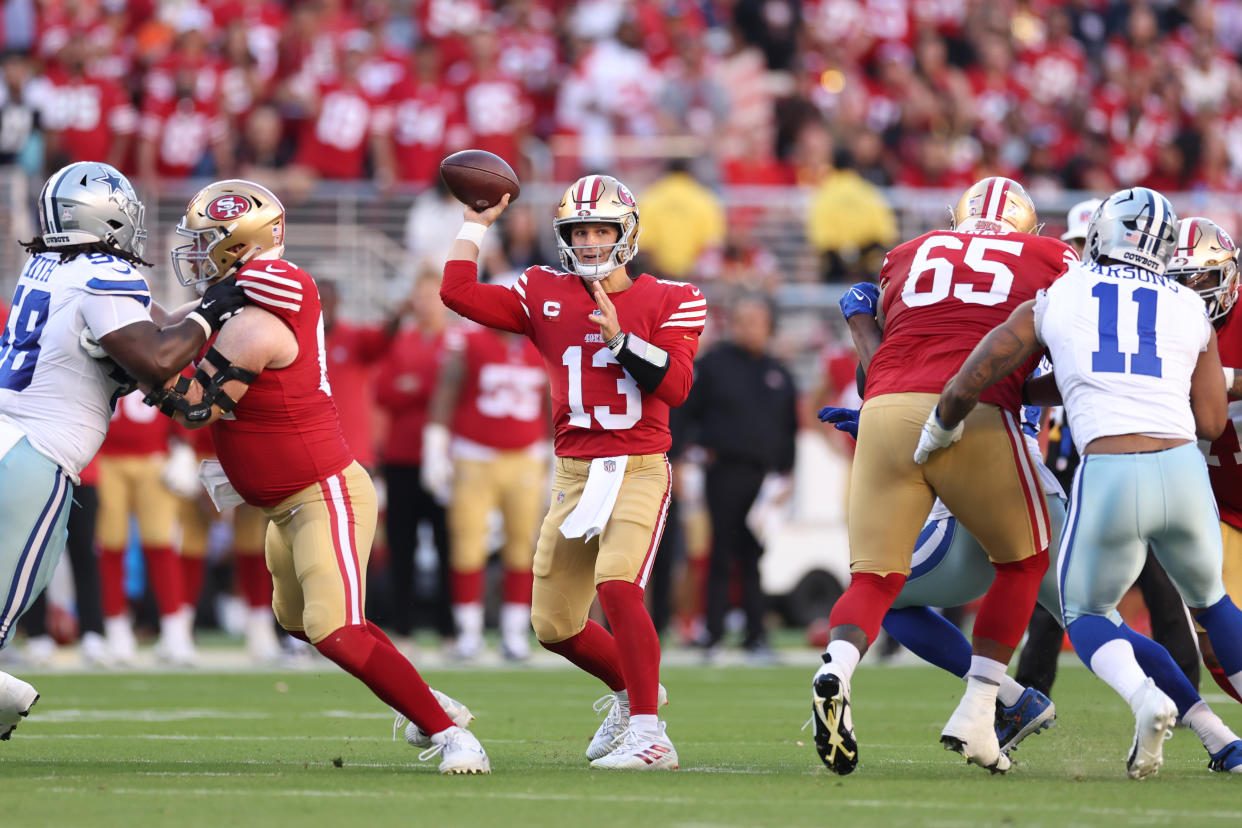 Brock Purdy found George Kittle twice for touchdowns in the first half on Sunday night.