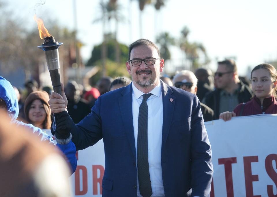 Secretary of State Adrian Fontes joins hundreds of people marching through the streets of downtown Phoenix in honor of Martin Luther King Jr. on Jan. 15, 2024.