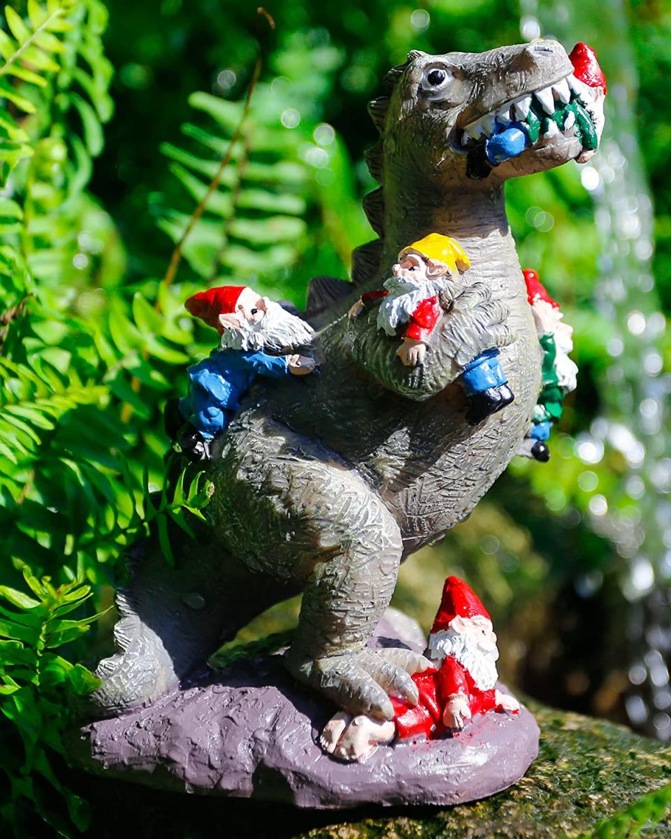 dinosaur eating gnomes statue, weird prime day deals