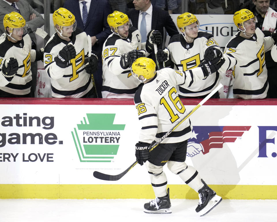 Pittsburgh Penguins' Jason Zucker (16) returns to the bench afters scoring during the third period of an NHL hockey game against the Philadelphia Flyers in Pittsburgh, Saturday, March 11, 2023. The Penguins won 5-1.(AP Photo/Gene J. Puskar)