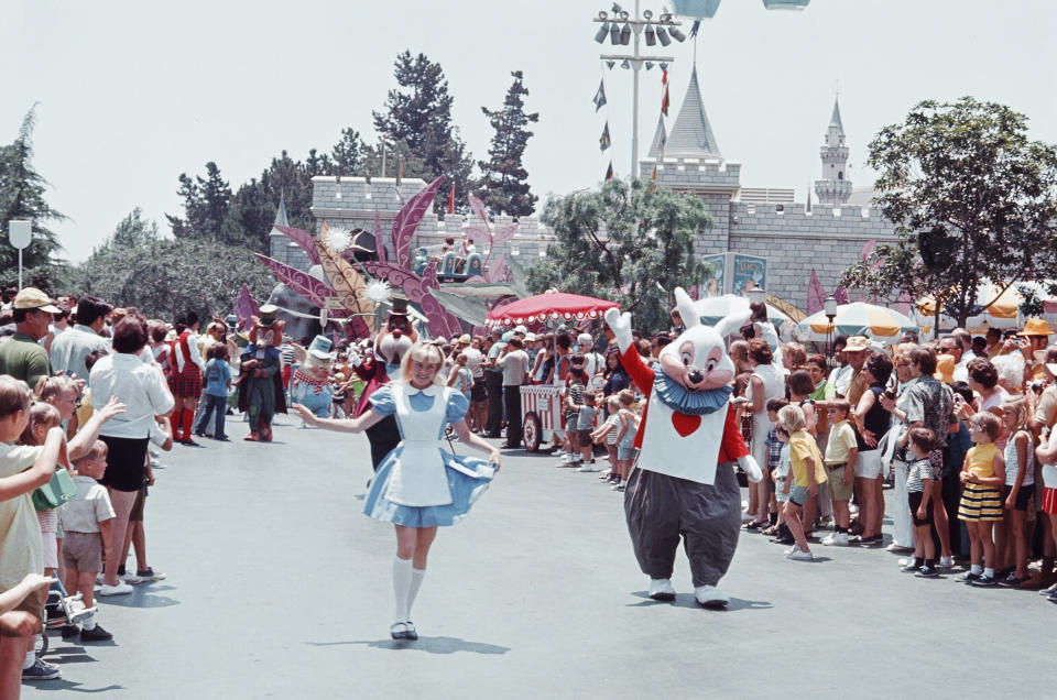 Characters greet guests during a parade at Disneyland in 1970.