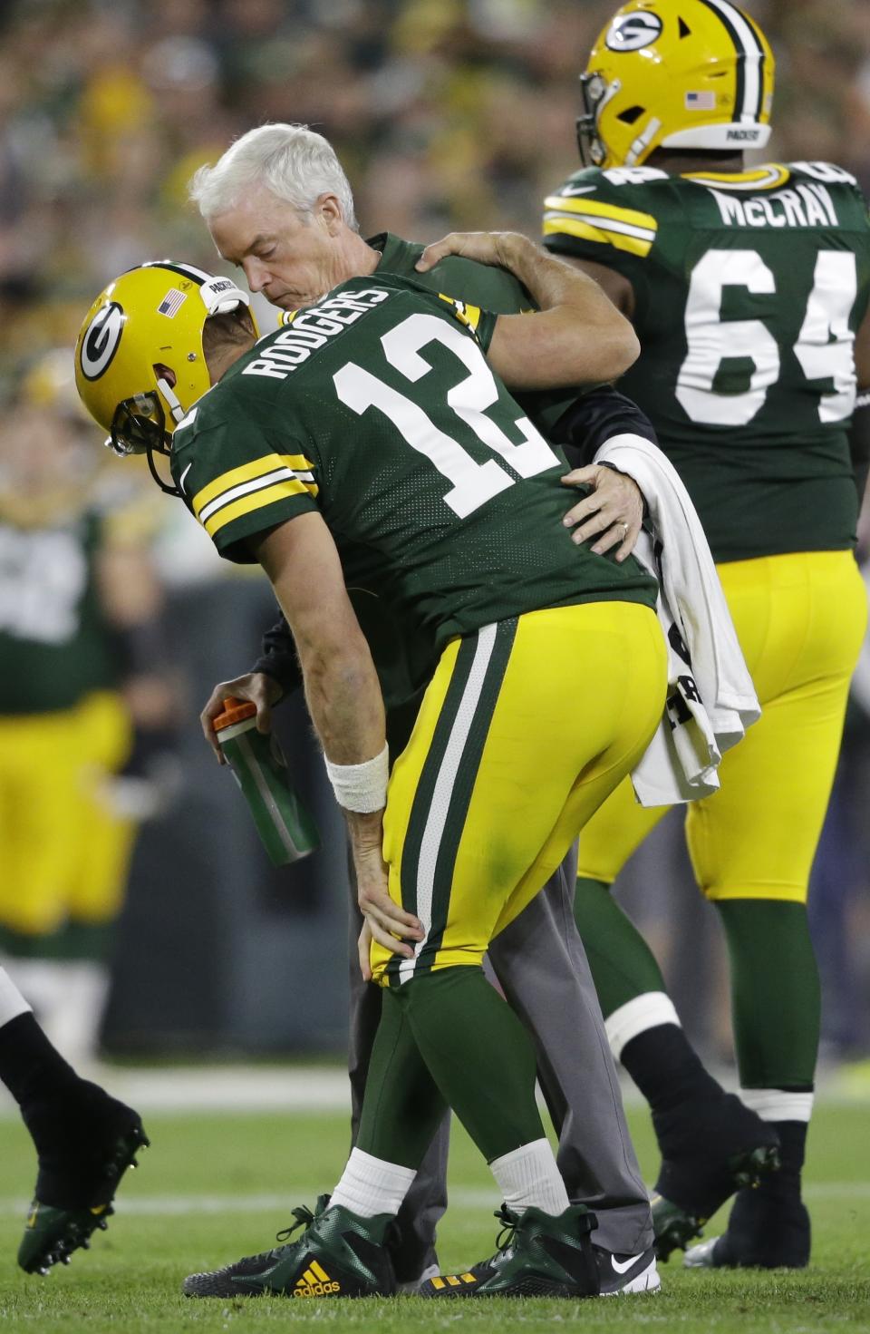 Green Bay Packers quarterback Aaron Rodgers is hurt after being sacked during the first half of an NFL football game against the Chicago Bears Sunday, Sept. 9, 2018, in Green Bay, Wis. (AP Photo/Jeffrey Phelps)