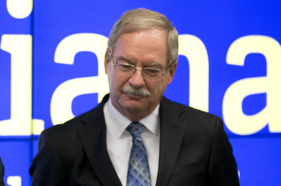 FILE - Rep. Dan Leonard, R-Huntington, listens to Indiana Gov. Mike Pence, announcing the federal loan that the state took out to pay unemployment benefits during the recession will be repaid from funds from Indiana's surplus on in Indianapolis, Thursday, Oct. 22, 2015. Conservatives in GOP-dominated Indiana are trying to push the Republican-controlled Legislature further to the right on issues like abortion and guns. Roughly two dozen so-called “liberty candidates” are running in Tuesday, May 2, 2022 primary, and the targets include several top-ranking GOP House members (AP Photo/Michael Conroy, File)