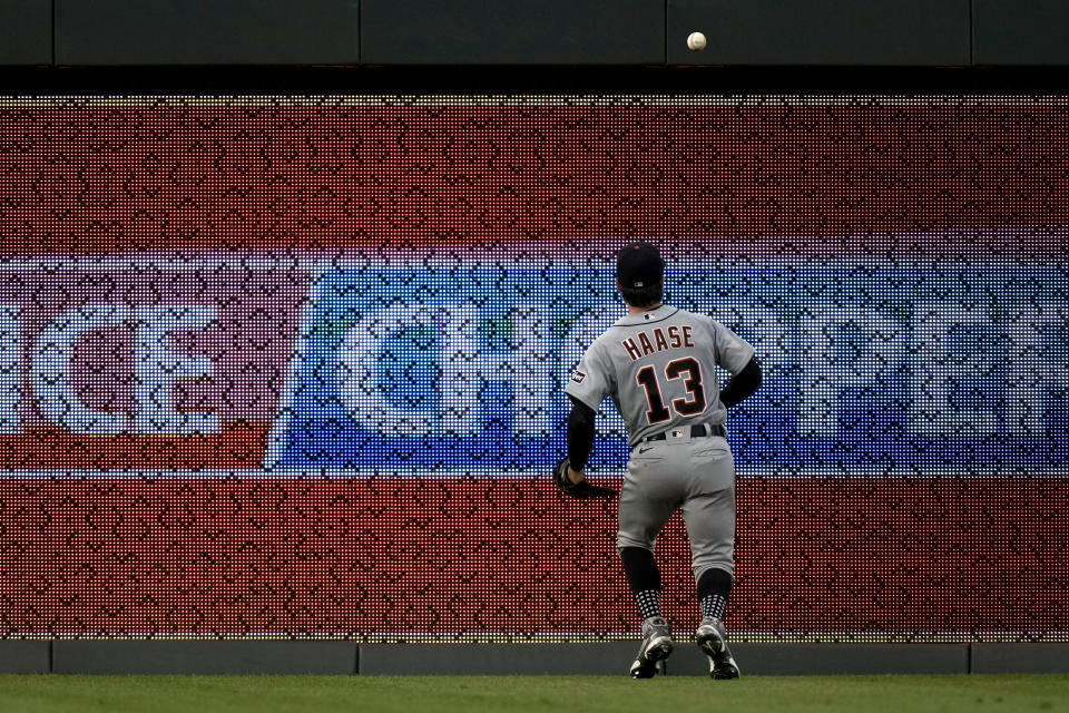 Detroit Tigers left fielder Eric Haase chases an RBI double hit by Kansas City Royals' Freddy Fermin during the fourth inning of a baseball game Tuesday, July 18, 2023, in Kansas City, Mo. (AP Photo/Charlie Riedel)