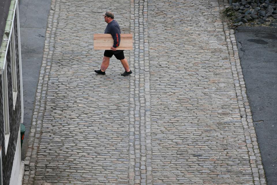 Filmmakers will be out and about in downtown New Bedford this Saturday for the NB 48: Filmmaker's Challenge. In this Standard Times photo, a man walks across the cobbled Rose Alley in downtown New Bedford.