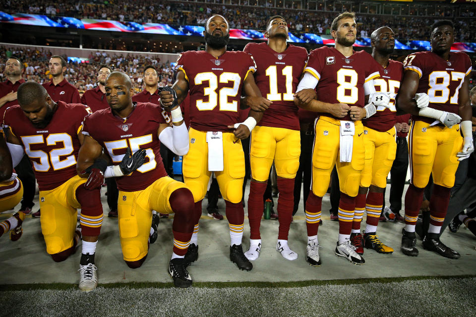 Washington Redskins players during the the national anthem before the game against the Oakland Raiders at FedExField on Sept. 24, 2017.