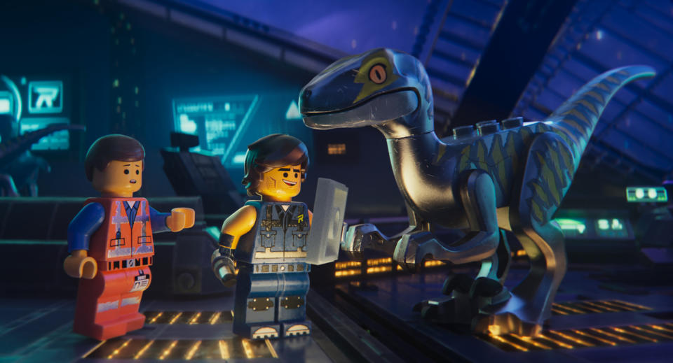 This image released by Warner Bros. Pictures shows the characters Emmet, left, and Rex Dangervest, center, both voiced by Chris Pratt, in a scene from "The Lego Movie 2: The Second Part." (Warner Bros. Pictures via AP)