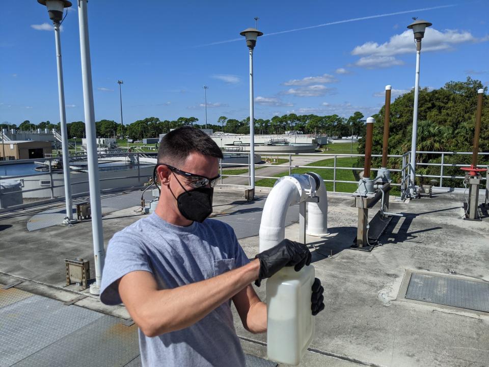 Danny Tomasello, a Laboratory Technician at the Loxahatchee River District, collects a wastewater sample.