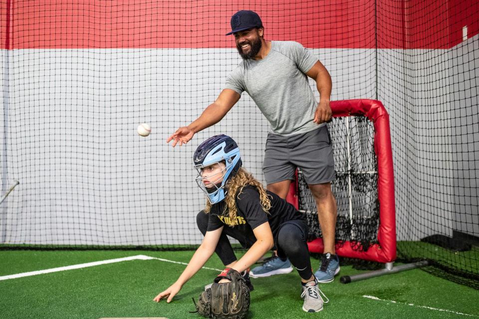 Marcus Lemon, right, practices with Gavin Gaynor, 10, at Chet Lemon's Big Yards on the third floor of the Big House in Tavares, Fla., on Wednesday, May 22, 2024.