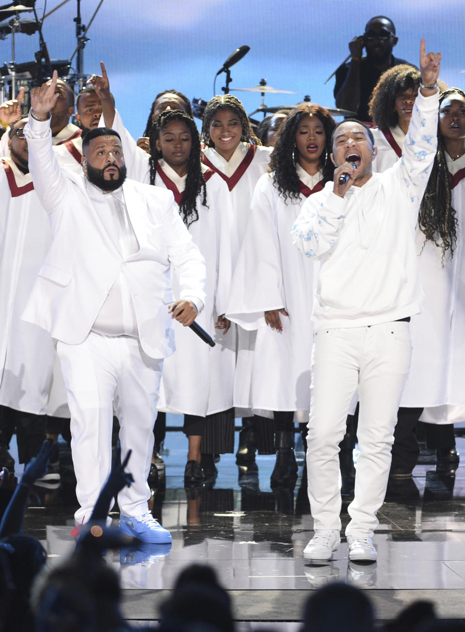 FILE - In this June 23, 2019 file photo, DJ Khaled, left, and John Legend, right, perform during a tribute to late rapper Nipsey Hussle at the BET Awards in Los Angeles. Legend latest release "Bigger Love" comes out Friday, June 19. (Photo by Chris Pizzello/Invision/AP, File)