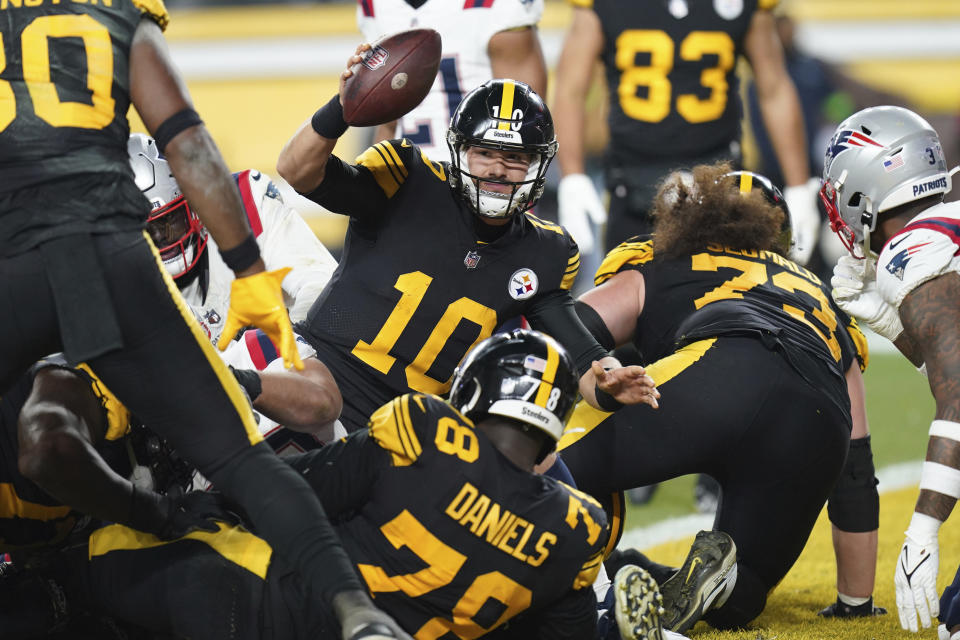 Pittsburgh Steelers quarterback Mitch Trubisky (10) celebrates after scoring on a 1-yard run during the second half of an NFL football game against the New England Patriots on Thursday, Dec. 7, 2023, in Pittsburgh. (AP Photo/Matt Freed)