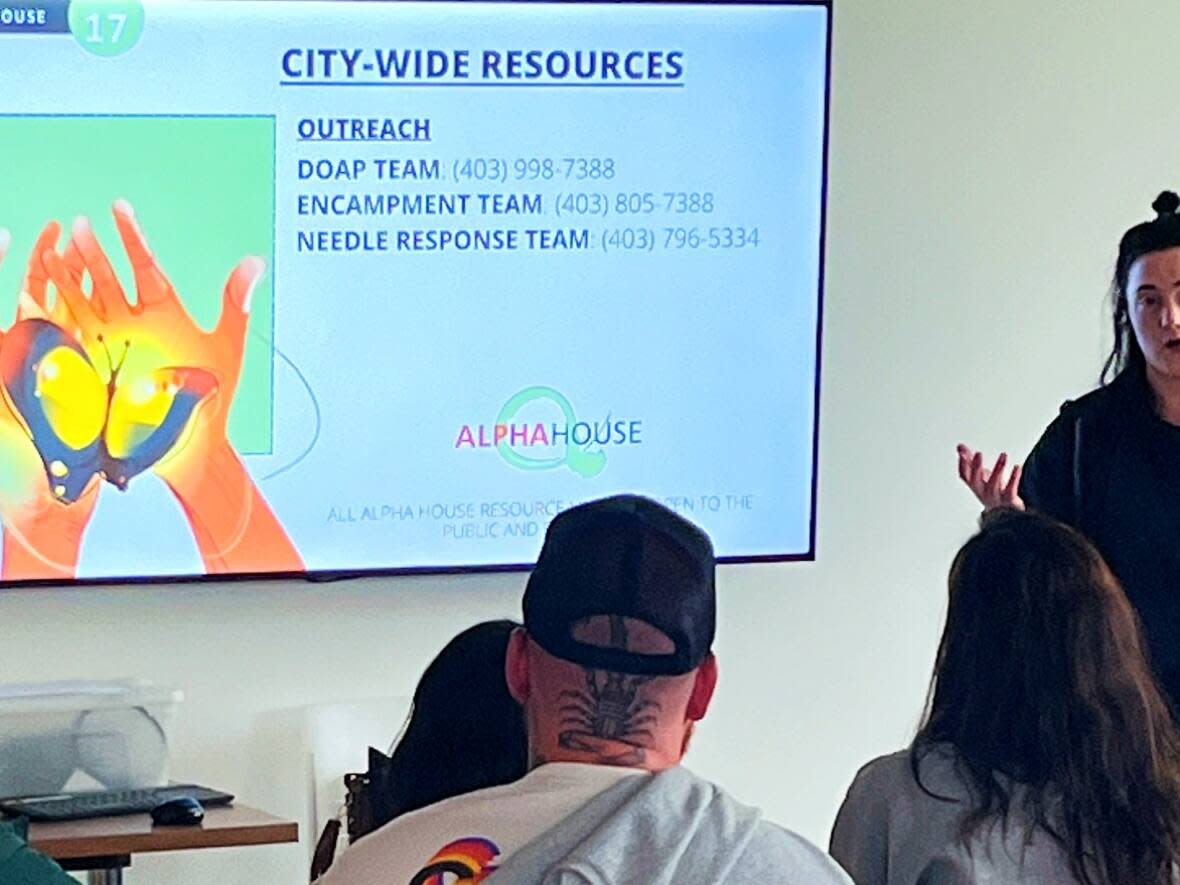 Shaundra Bruvall, communications and program manager at Alpha House Society, speaks at a workshop on homelessness on Wednesday. (Jo Horwood/CBC - image credit)